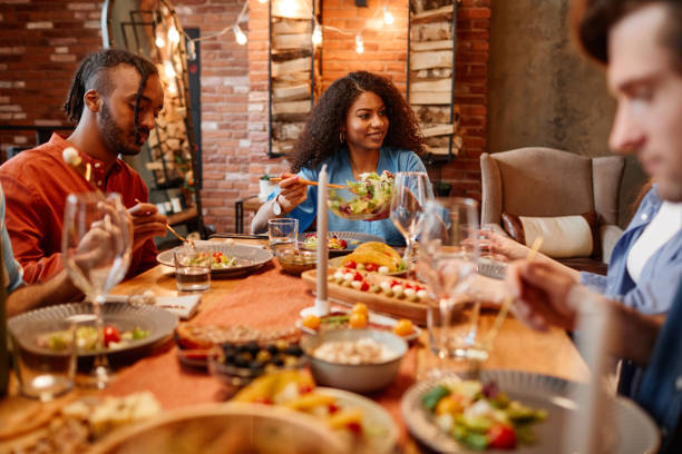 istock Friends Enjoying Dinner Party 1413738155