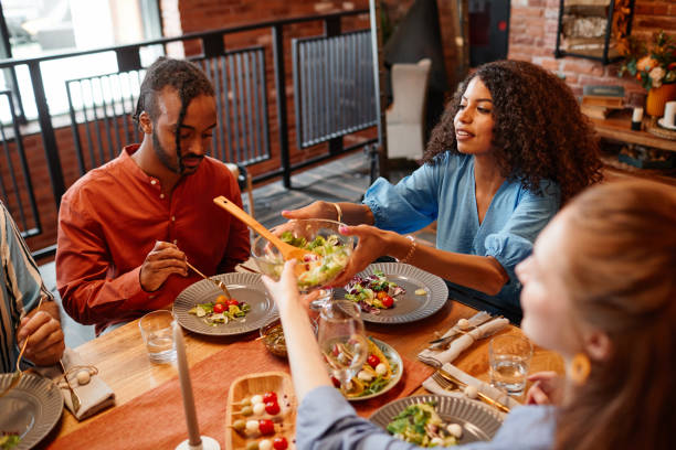 istock Multiethnic Friends Enjoying Dinner Party 1413738158