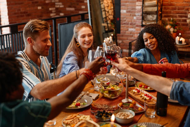 istock People Enjoying Drinks at Dinner Party 1413738170