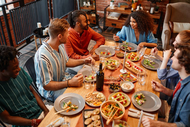 istock Diverse Friends Enjoying Dinner Party 1413738171