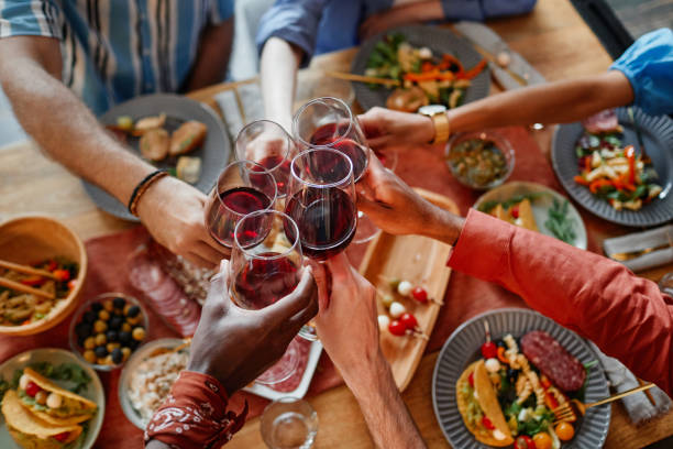 istock Friends Celebrating at Dinner Party 1413738179