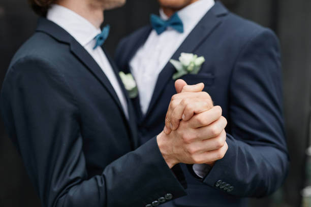 Same Sex Couple Dancing Close up of two men dancing together during wedding ceremony, same sex marriage civil partnership stock pictures, royalty-free photos & images