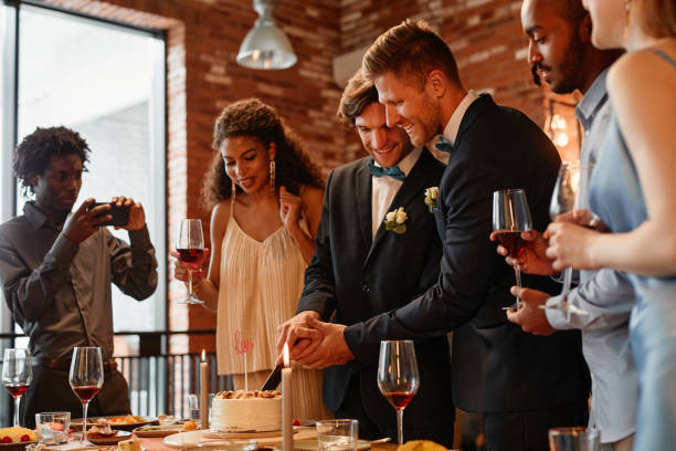istock Same Sex Couple Cutting Cake 1413738220