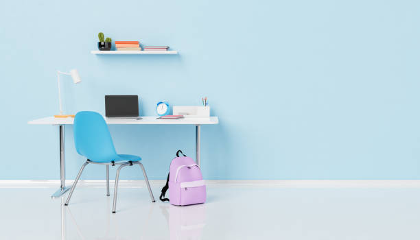 istock Backpack placed near desk with laptop and textbooks 1413738278