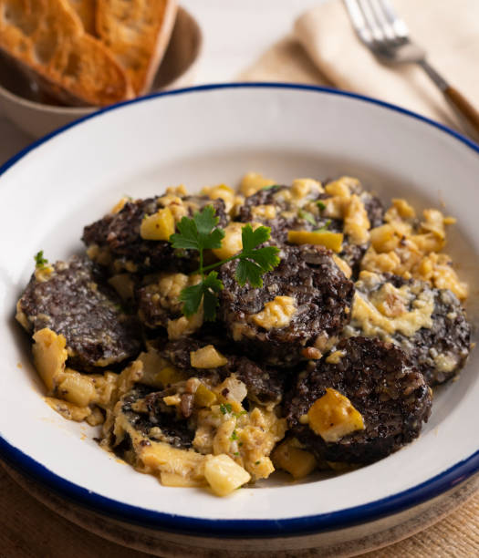 istock Revuelto de morcilla. Scrambled eggs with blood sausage. Typical Spanish recipe. 1413739368