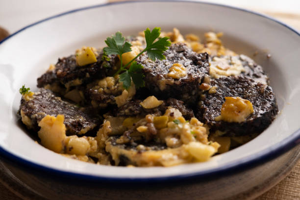 istock Revuelto de morcilla. Scrambled eggs with blood sausage. Typical Spanish recipe. 1413739375