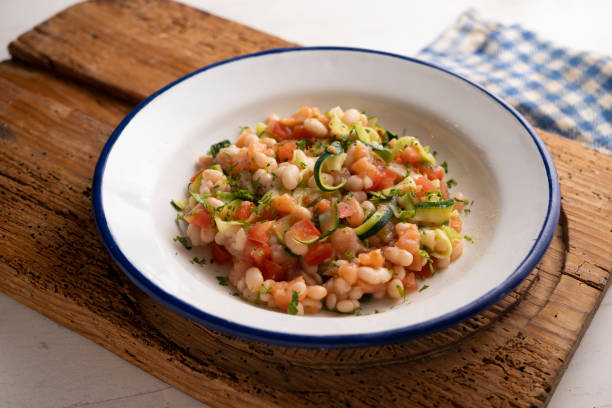 istock Broad bean salad with zucchini, salmon and tomato. 1413739376