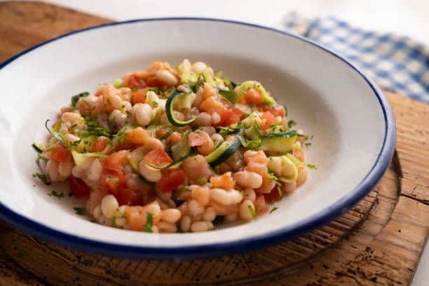 istock Broad bean salad with zucchini, salmon and tomato. 1413739390