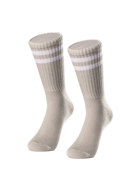 istock Long beige socks on a white insulated background 1413740389