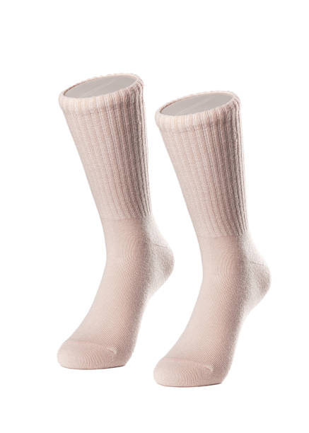 istock Long beige socks on a white insulated background 1413740545