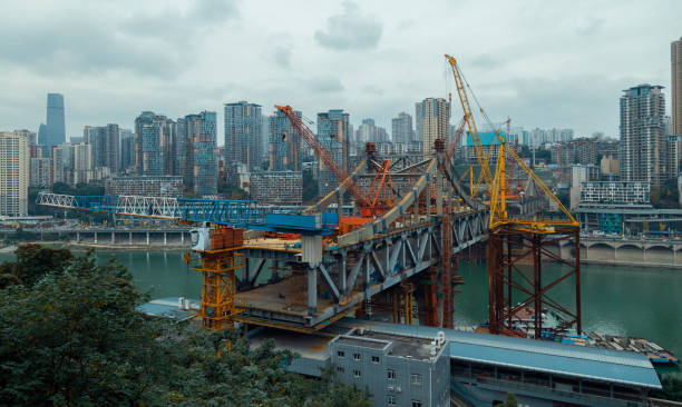 istock Cross-river bridge under construction in Chongqing, China 1413742650
