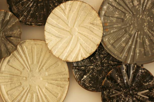 modern round wall decoration made from copper.