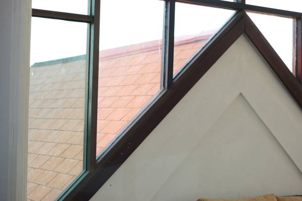 istock geometric shaped window frames with large transparent glass so that sunlight make the room brighter. 1413745280