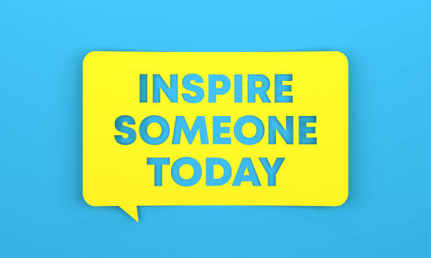 istock Yellow speech bubble with Inspire Someone Today lettering on blue background 1413745358