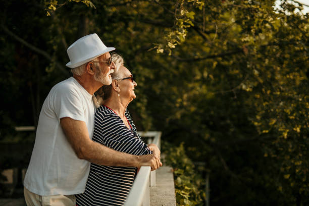istock Senior couple enjoying sunset 1413747874