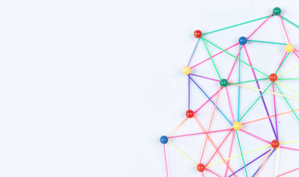 Linking entities, Blockchain, social media, Communications Network, The connection between the two networks. Network simulation on paper linked together by yarn