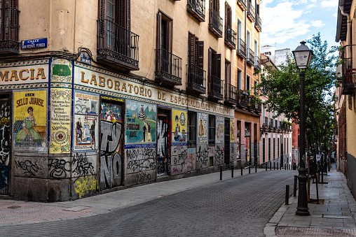 Madrid, Spain - June 5, 2022: Malasana quarter in central Madrid. It is a vibrant neighborhood and a center for the hipster phenomenon, full of lively bars and clubs overflowing with young people. Its creative and countercultural roots