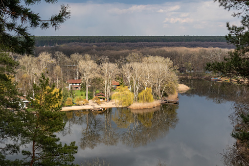 Spring sunny river bank with recreation area and forest. Cossack mountain, Koropove village on Siverskyi Donets River in Ukraine