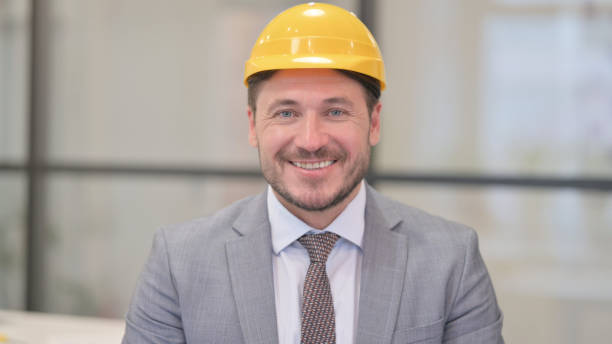 istock Portrait of Middle Aged Engineer Smiling at Camera 1413756684