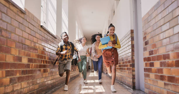 istock Children, students and young people running to class excited about learning, education and studying with their friends. Primary school kids sprinting in the corridor hallway happy for the next lesson 1413757500