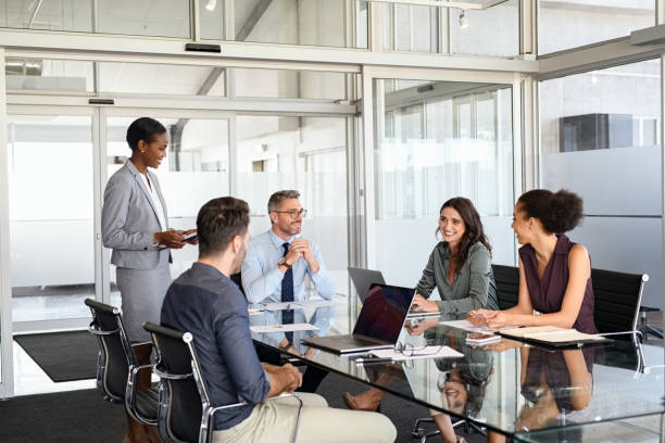 Formal business people in meeting room stock photo
