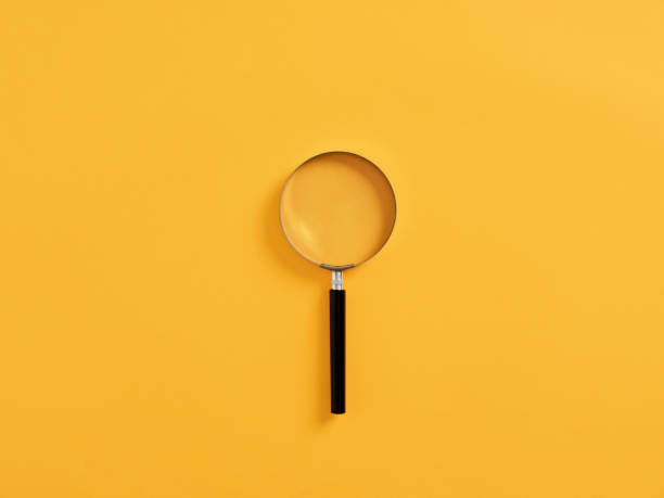 istock Magnifying glass or magnifier on yellow background 1413759214