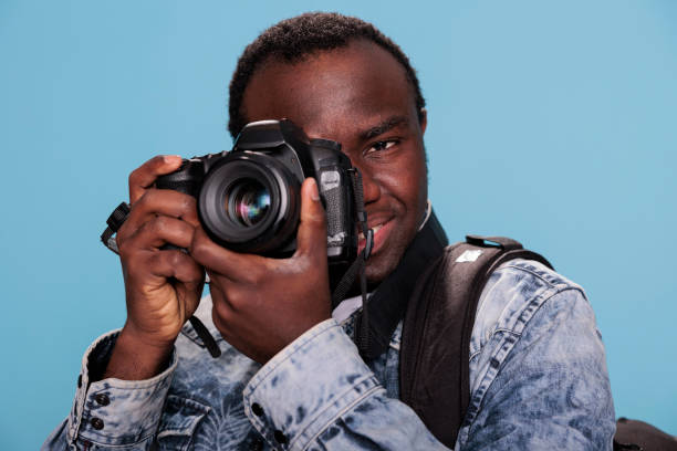 istock Photography enthusiast taking photo with DSLR camera 1413759747