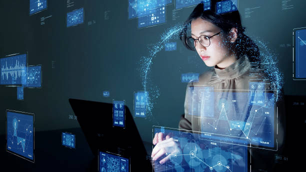 Young asian woman watching hologram screens. Business technology. stock photo