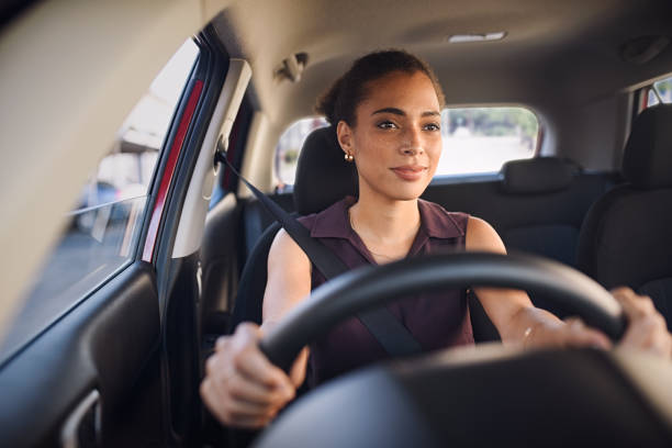 Young black woman driving car stock photo
