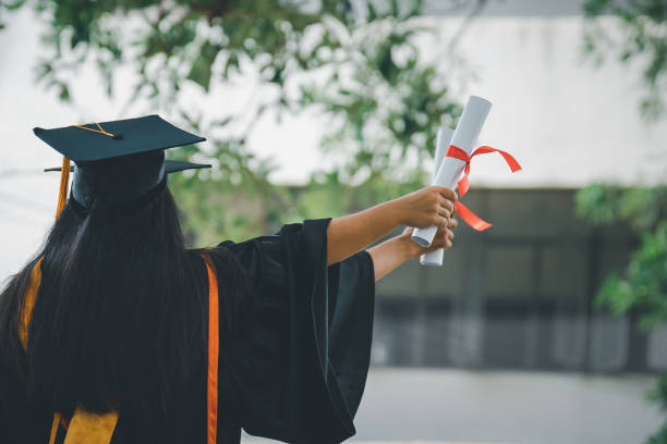 istock Graduates wear a black hat to stand for congratulations on graduation 1413762616