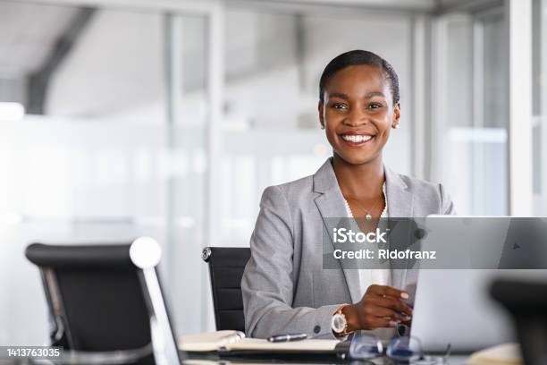 Portrait Of Smiling Black Businesswoman Looking At Camera Stock Photo - Download Image Now