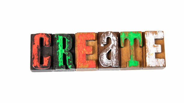 istock CREATE. Colored wooden letters on a white background 1413763747
