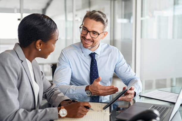 istock Multiethnic business people working together on digital tablet 1413764090