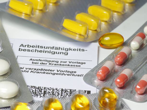 istock Certificate of disability with pills 1413764131