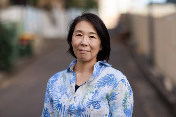 istock Smiling happy woman on a street 1413766468