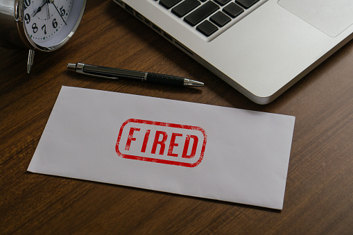 Fired text on paper envelope to dismiss the employee.Fired jobs concept.