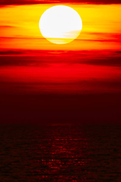 istock Tropical sunset sunrise over the ocean sea horizon. 1413770708