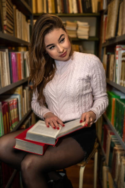 istock a young smart student is studying useful and interesting in a beautiful old library. 1413770892
