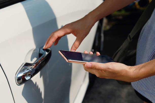 using mobile app device on smartphone to unlock car doors - car car door car key door imagens e fotografias de stock