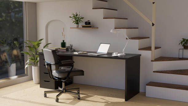 istock Modern stylish home office working space interior with modern black computer desk against the stairs. 1413771137