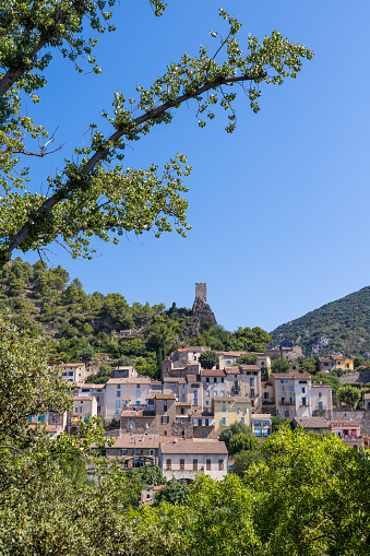 Summer view on the village of Roquebrun from the banks of the Orb River