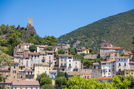 Summer view on the village of Roquebrun from the banks of the Orb River
