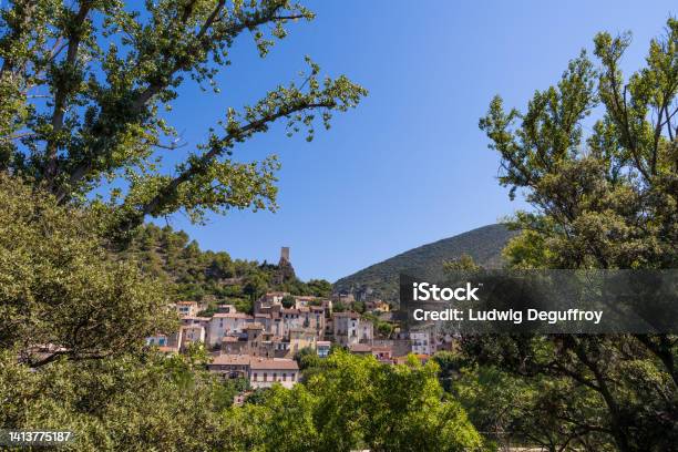 Summer View On The Village Of Roquebrun From The Banks Of The Orb River Stock Photo - Download Image Now