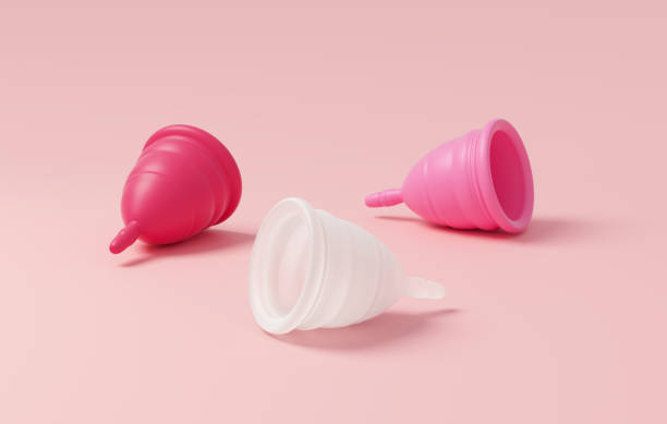 istock Three menstrual cups isolated on a pink background for banner design. Zero waste, eco and reusable alternatives for period and woman hygiene concept in 3D illustration 1413776769