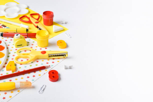 istock Various red and yellow stationery items lie on a white background. Back to school 1413777719