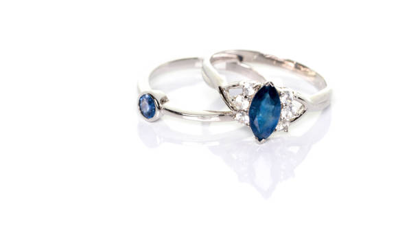 istock Blue Sapphire with diamonds Jewel or gems ring on white background with reflection. Collection of natural gemstones accessories. Studio shot 1413778756