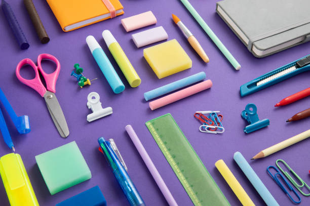 istock School Supplies on Purple Background 1413781458