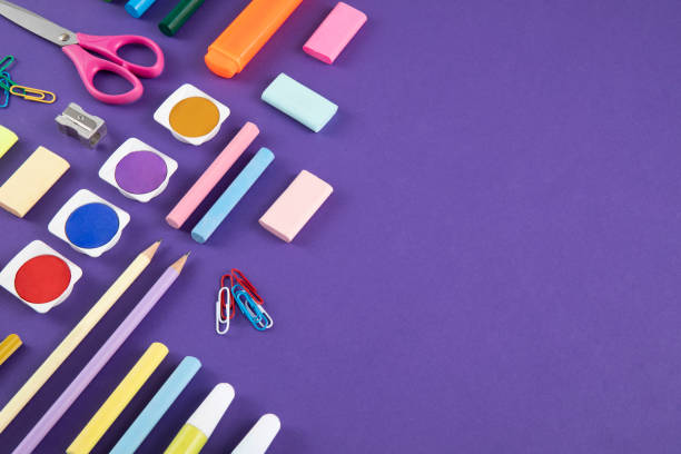 istock School Supplies on Purple Background 1413781855