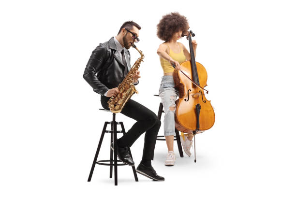 man sitting and playing a saxophone and a woman playing a cello - full metal jacket imagens e fotografias de stock