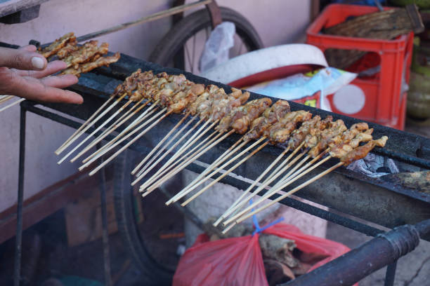 istock Satay on fire with smoke and an appetizing look. 1413785307